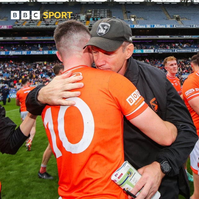 Armagh boss Kieran McGeeney is embraced by Oisin Conaty at full-time