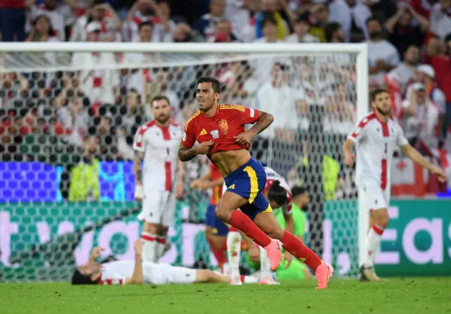 Rodri pulls up his shirt to celebrate scoring a goal