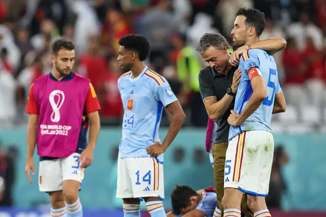 Luis Enrique, head coach of Spain consoles Sergio Busquets after the penalty shoot-out