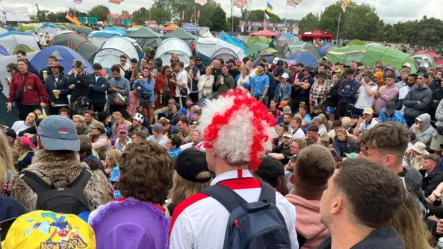 A man with an England hat in a crowd