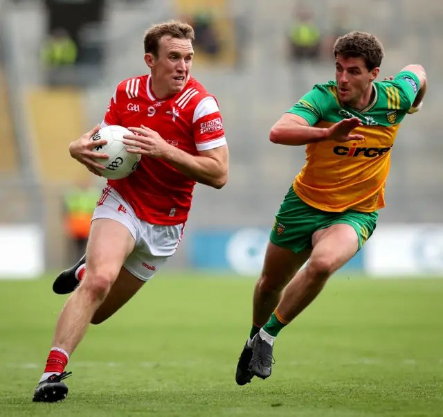 Louth's Bevan Duffy in action against Daire Ó Baoill