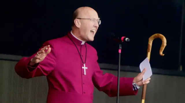 Michael Beasley, bishop of Bath and Wells, addresses the Pyramid Stage crowds