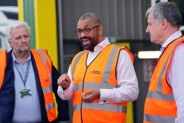 Home Secretary James Cleverly dons a hi-vis vest during a visit to Swain Group in Rochester, Kent, while on the General Election campaign trail.