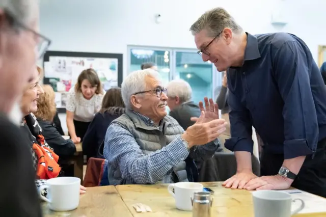 Labour Party leader Sir Keir Starmer meets pensioners to talk about the impact of the energy crisis and cost of living during a visit to the Bridge Cafe in Bolton whilst campaigning in the north west of England. Later the Labour leader will go head to head with Conservative Party leader, Prime Minister Rishi Sunak during an ITV election debate.