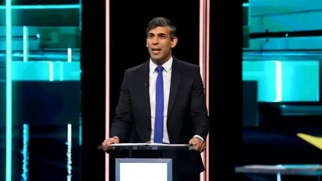 Rishi Sunak speaks at a lectern