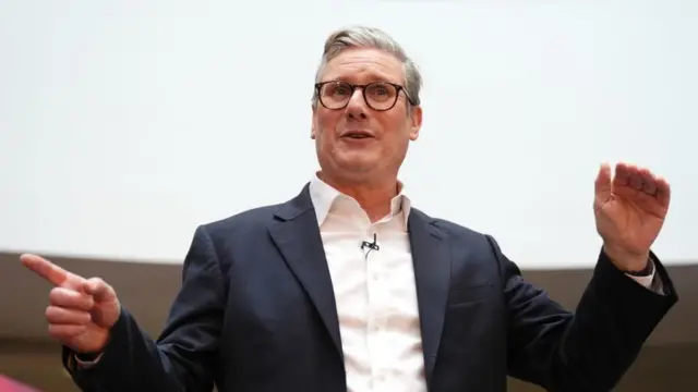 Keir Starmer gestures as he speaks