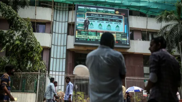 A screen displaying stock numbers outside the Bombay Stock Exchange (BSE) building in Mumbai