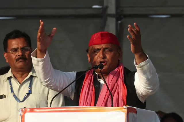 Samajwadi Party President Akhilesh Yadav (R) speaks during an election rally of Indian National Developmental Inclusive Alliance (INDIA) on the outskirts of Varanasi on May 28, 2024, during country's ongoing general election. (Photo by Niharika KULKARNI / AFP) (Photo by NIHARIKA KULKARNI/AFP via Getty Images)