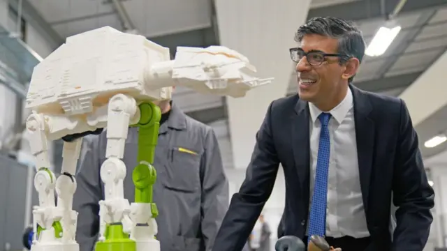 Prime Minister Rishi Sunak is shown a D printed model of an All Terrain Armoured Transport Walker from Star Wars in March