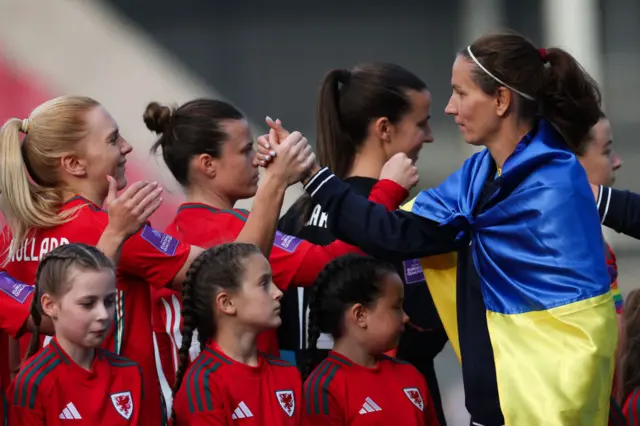 Wales v Ukraine anthems, players shaking hands