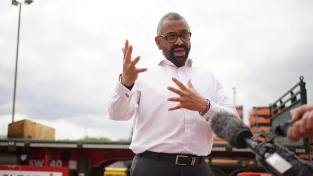 Home Secretary James Cleverly speaks to the media during a visit to Swain Group in Rochester, Kent, while on the General Election campaign trail.