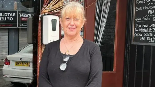 Linda pictured in front of her cafe