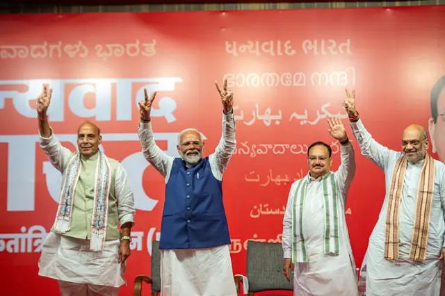 Prime Minister Narendra Modi seen making the victory sign with senior party leaders Rajnath Singh, JP Nadda and Amit Shah from the stage while celebrating the party's win at BJP headquarters