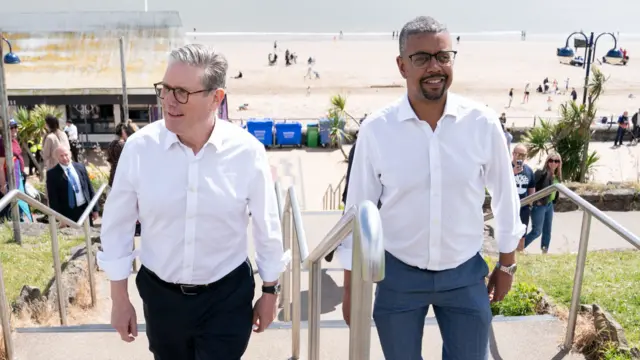 Labour Party leader Sir Keir Starmer (left) and First Minister of Wales Vaughan Gething ( right) on Barry seafront after the launch of Labour's six steps for change in Wales in Abergavenny