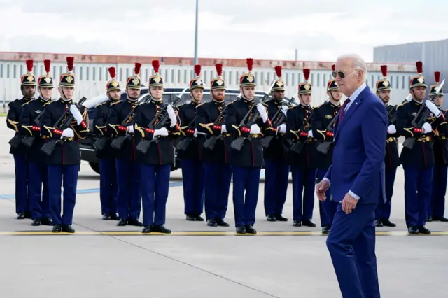 US President Joe Biden is greeted by honour guard as he arrives at the Paris-Orly Airport