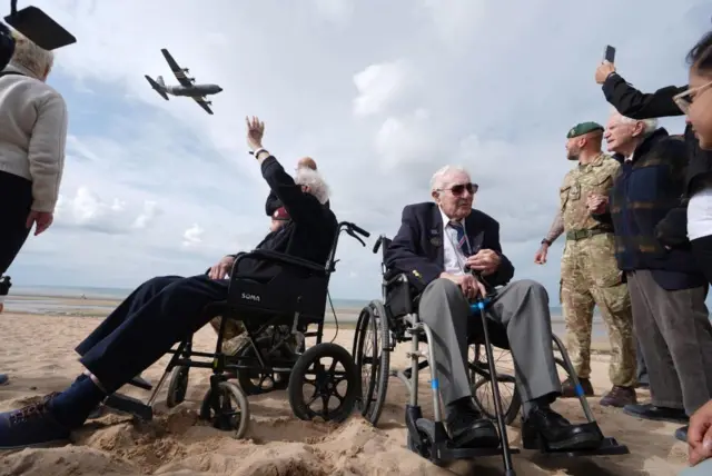 Veterans John Life and Donald Jones on Sword Beach in Normandy on Tuesday, as the RAF flew overhead