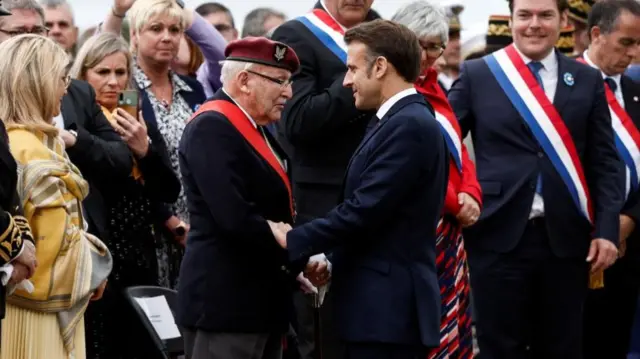 French President Emmanuel Macron and Achille Muller, 98, last survivor of the Free French Forces, attend a ceremony to pay homage to French resistance fighters in Normandy