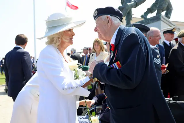 Queen Camilla speaks to D-Day veteran Henry Rice, 98,