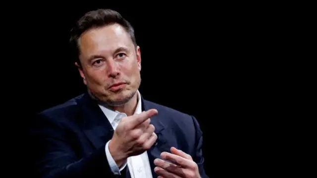 Elon Musk gestures as he speaks