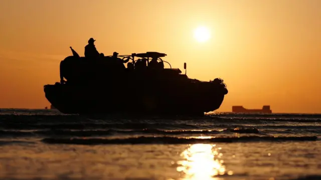A DUKW amphibious vehicle arrivies ahead of playing a dawn lament on Gold Beach in Arromanches in Normandy, France, to commemorate the 80th anniversary of the D-Day landings. Picture date: Thursday June 6, 2024