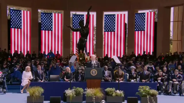 Joe Biden on stage a memorial event