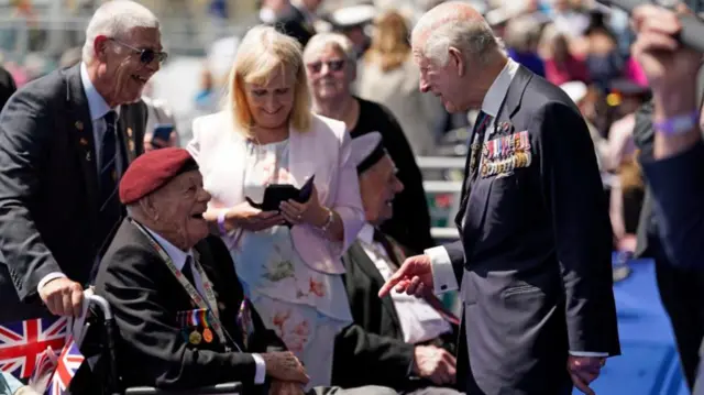 King Charles meets Normandy veteran Lew Trewin in Portsmouth on Tuesday