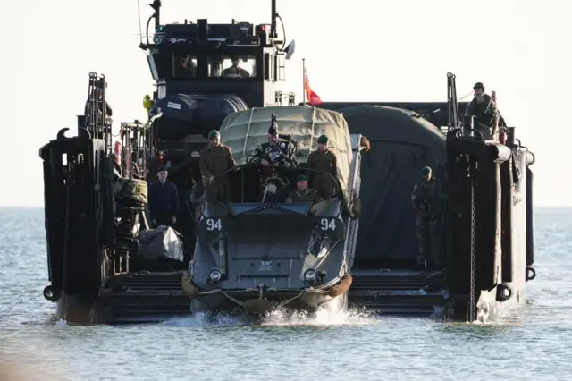 A military piper comes into shore on a DUKW amphibious vehicle ahead of playing a dawn lament on Gold Beach in Arromanches in Normandy, France, to commemorate the 80th anniversary of the D-Day landings. Picture date: Thursday June 6, 2024. PA Photo