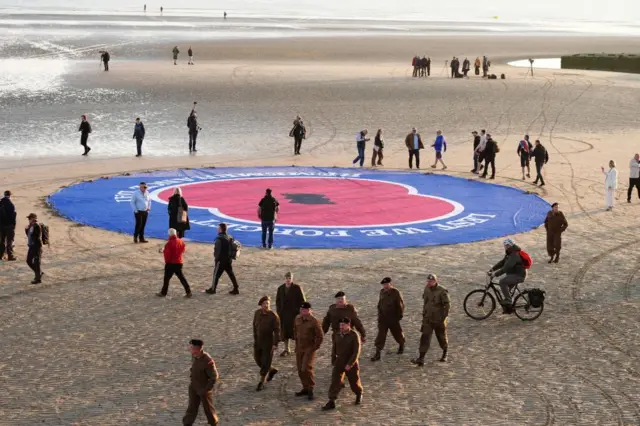 A giant poppy is displayed on Gold Beach in Arromanches in Normandy, France, to commemorate the 80th anniversary of the D-Day landings. Picture date: Thursday June 6, 2024