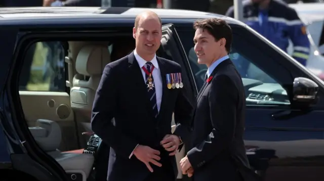 Britain's William, Prince of Wales (L) and Canadian Prime Minister Justin Trudeau (R) attend a commemorative ceremony for the 80th anniversary of D-Day landings in Normandy at the Canadian cemetery in Courseulles-sur-Mer, France, 06 June 2024.