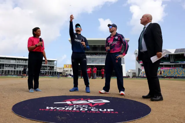 Picture of the captains tossing coin