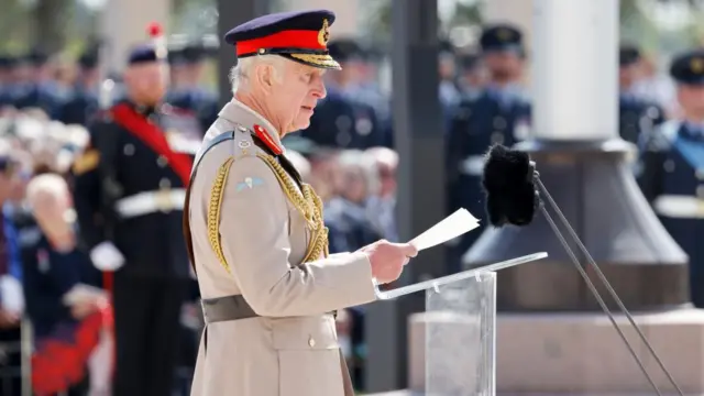 Britain's King Charles III delivers a speech during the UK Ministry of Defence and the Royal British Legion's commemorative ceremony marking the 80th anniversary of the World War II 'D-Day' Allied landings in Normandy, at the World War II British Normandy Memorial near the village of Ver-sur-Mer which overlooks Gold Beach in northwestern France, 06 June 2024