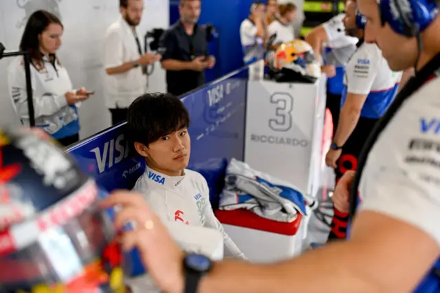 Yuki Tsunoda waits in the RB garage