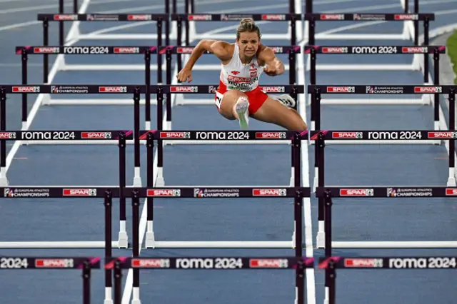 Klaudia Wojtunik competes in the women's 100m hurdles rerun