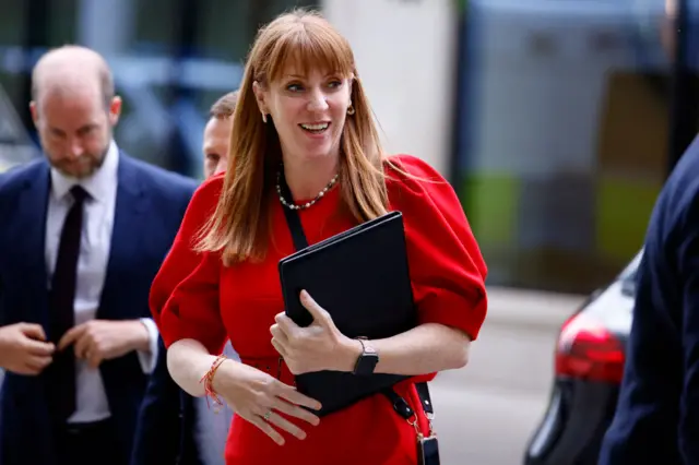 Angela Rayner carrying a black folder