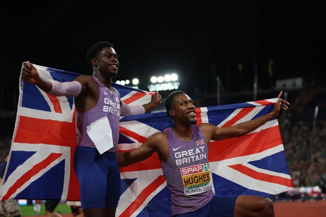 Jeremiah Azu of Great Britain and Silver medalist Zharnel Hughes of Great Britain celebrate after the 2022 Men's 100m Final during the Athletics