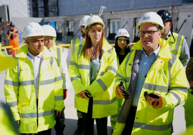 Sadiq Khan, Angela Rayner, and Keir Starmer in hard hat and hi vis