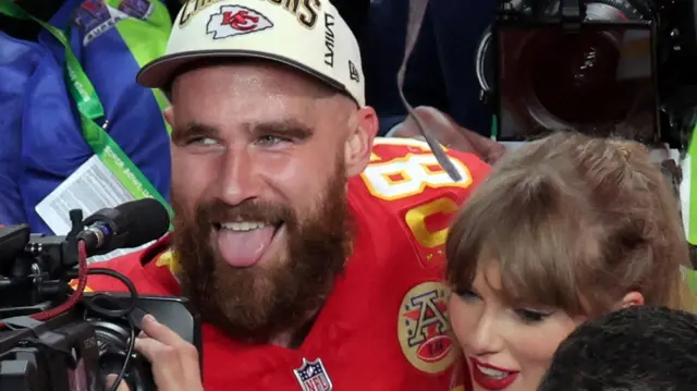 Travis Kelce celebrates winning the Super Bowl with girlfriend Taylor Swift