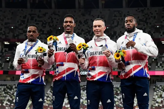 Chijindu Ujah, Britain's Zharnel Hughes, Britain's Richard Kilty, Britain's Nethaneel Mitchell-Blake, celebrate on the podium during the victory ceremony for the men's 4x100m relay event during the Tokyo 2020 Olympic Games