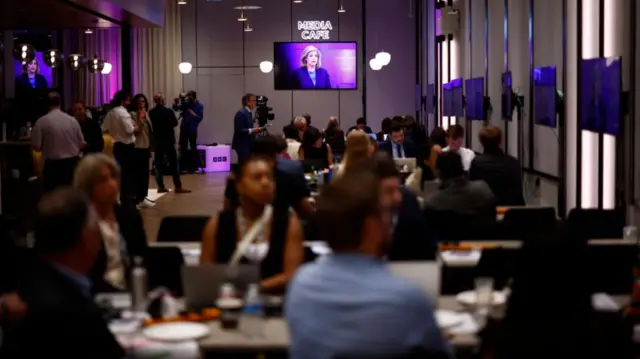 Journalists listen to Leader of the House of Commons, Conservative MP Penny Mordaunt inside the BBC Media Room in London