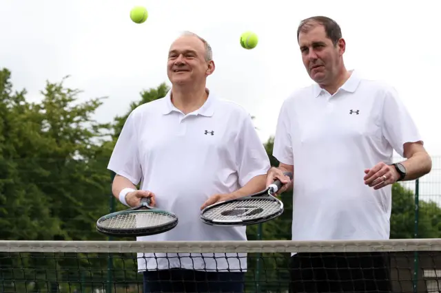 Liberal Democrats leader Ed Davey playing tennis with his party's parliamentary candidate for Newbury, Lee Dillon