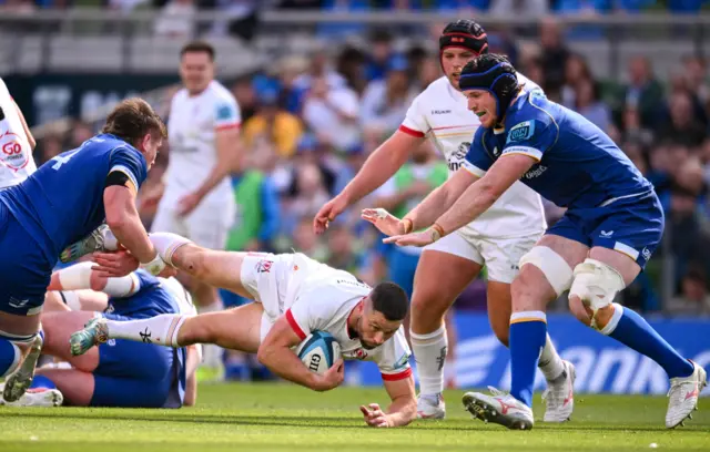 Joe McCarthy tackles Ulster fly-half John Cooney in the quarter-final