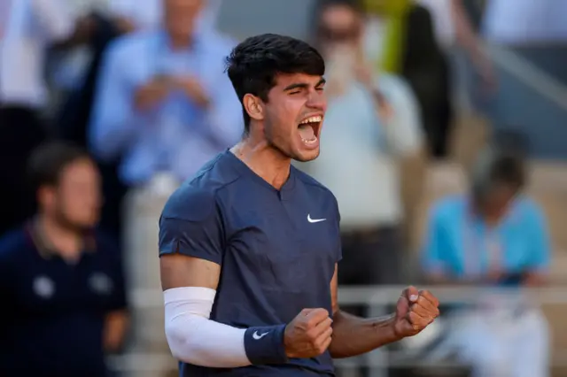 Carlos Alcaraz celebrating after win over Jannik Sinner