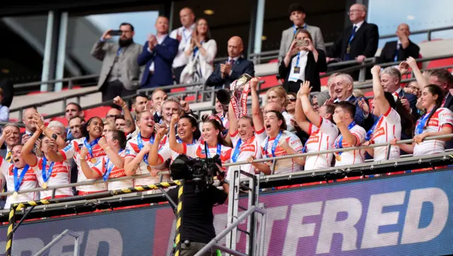 St Helens lift the Women's Challenge Cup trophy at Wembley