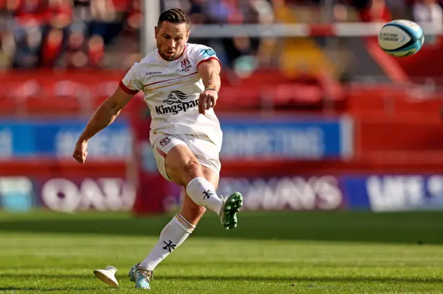 Scrum-half John Cooney kicks a penalty for Ulster