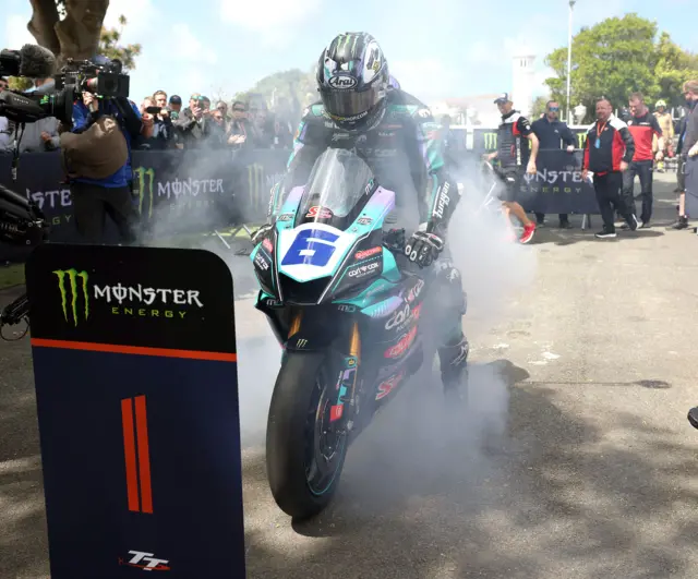 Michael Dunlop celebrates winning the Supersport TT