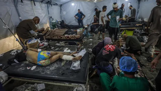 Wounded patients being treated by medical staff following an Israeli military operation in Al-Nusairat refugee camp in central Gaza