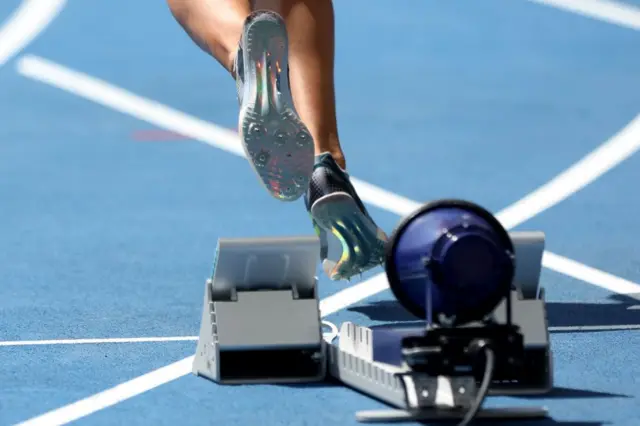 An athlete leaves the starting block