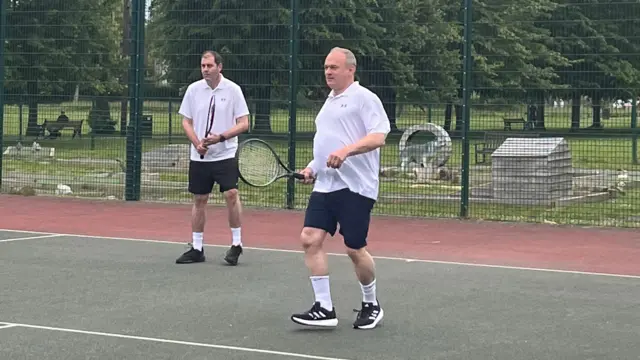 Ed Davey plays tennis