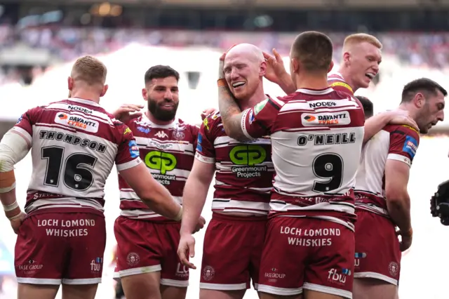 Wigan celebrate Liam Farrell's try