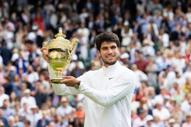 Carlos Alcaraz with the Wimbledon trophy in 2023